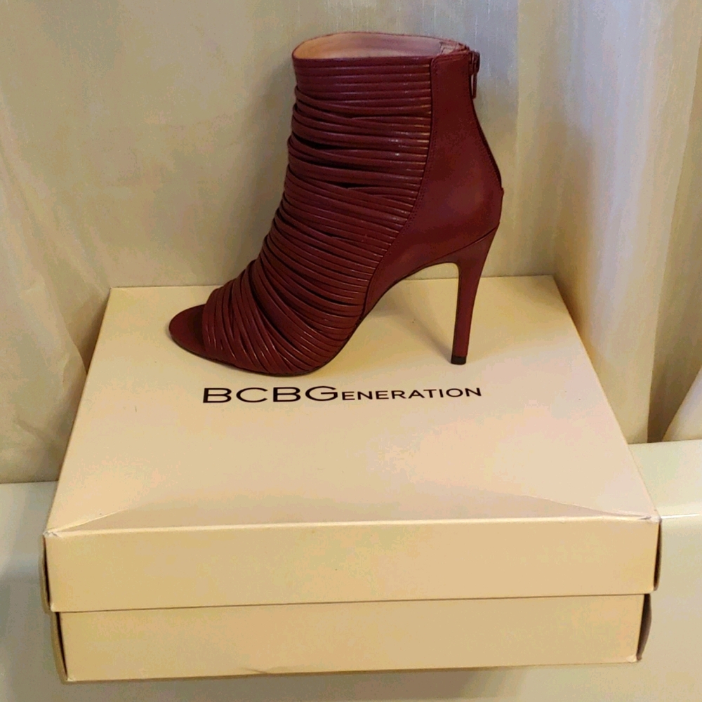 BCBG Burgundy strap heel never worn.